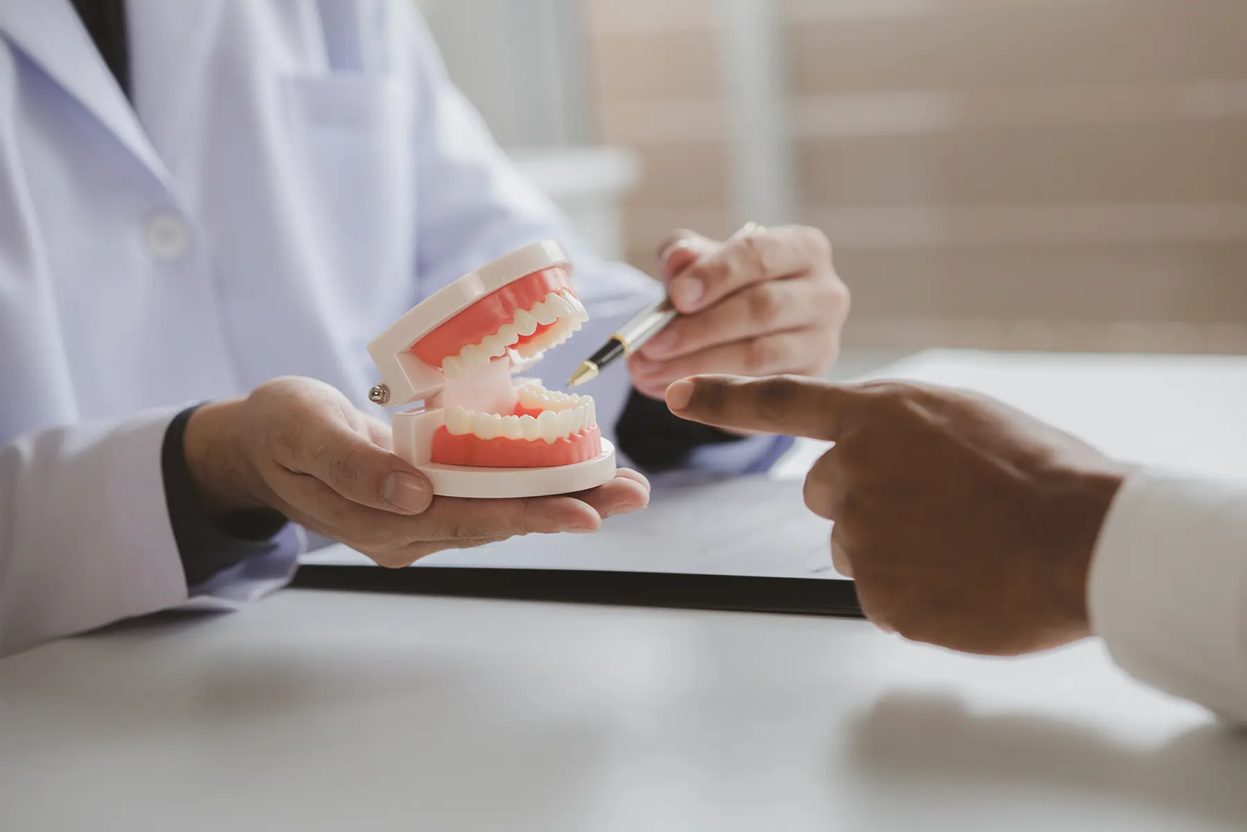 Learn about dentures and dental implants. We explain the pros and cons of each option, so you can make the best choice for your smile.
